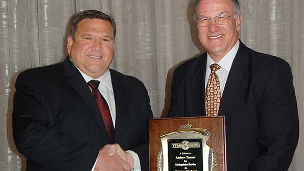 Incoming TTMA chairman Dick Giromini right thanks Andy Tanner for serving as TTMA chairman during the past year