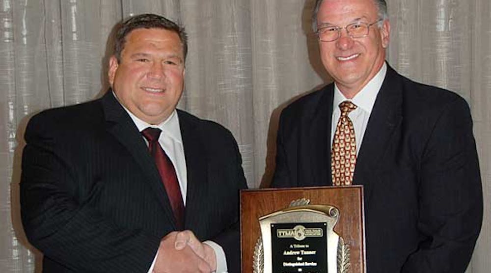 Incoming TTMA chairman Dick Giromini, right, thanks Andy Tanner for serving as TTMA chairman during the past year.