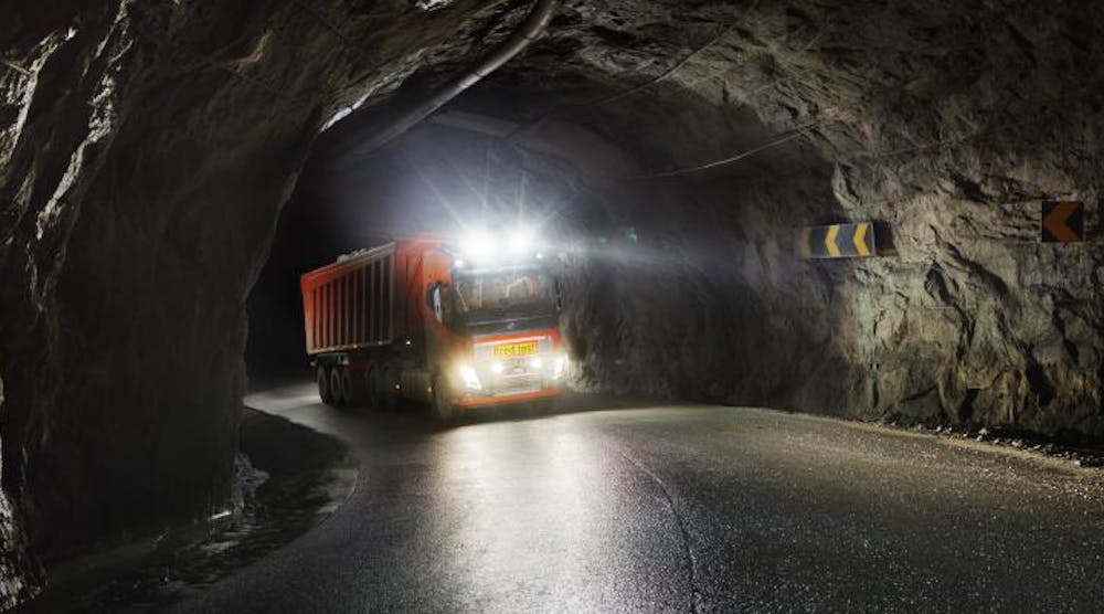 A Volvo FH navigates a tunnel at the mine.