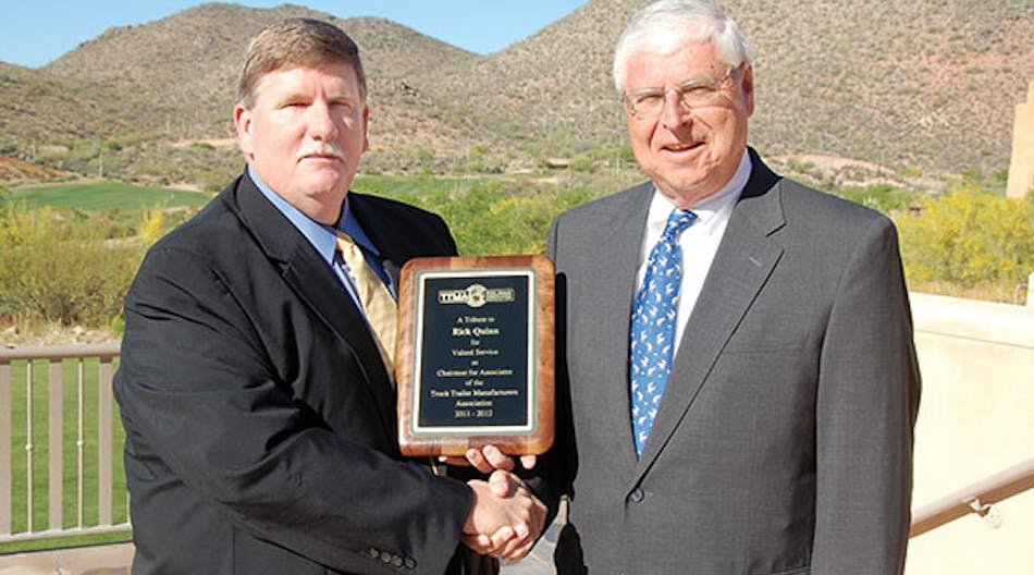 Bill Schaffer, left, thanks Rick Quinn for serving as chairman of the TTMA associate members for 2011-2012.
