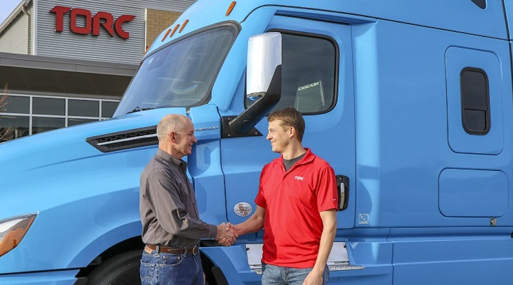 Roger Nielsen, left, president and CEO of Daimler Trucks North America, and Michael Fleming, president and CEO of Torc Robotics, recently agreed to work together on truck automation.