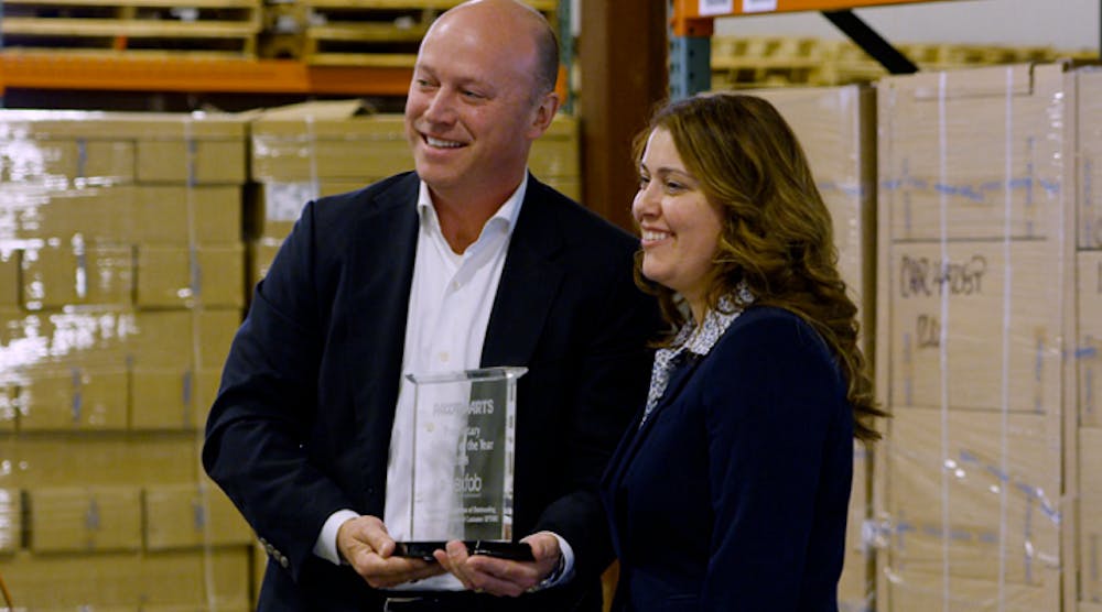 Blanka Kopacz, director of product marketing for PACCAR Parts, presented Matt DeCamp, president and CEO of Flexfab, with PACCAR&apos;s 2018 Proprietary Supplier of the Year award.