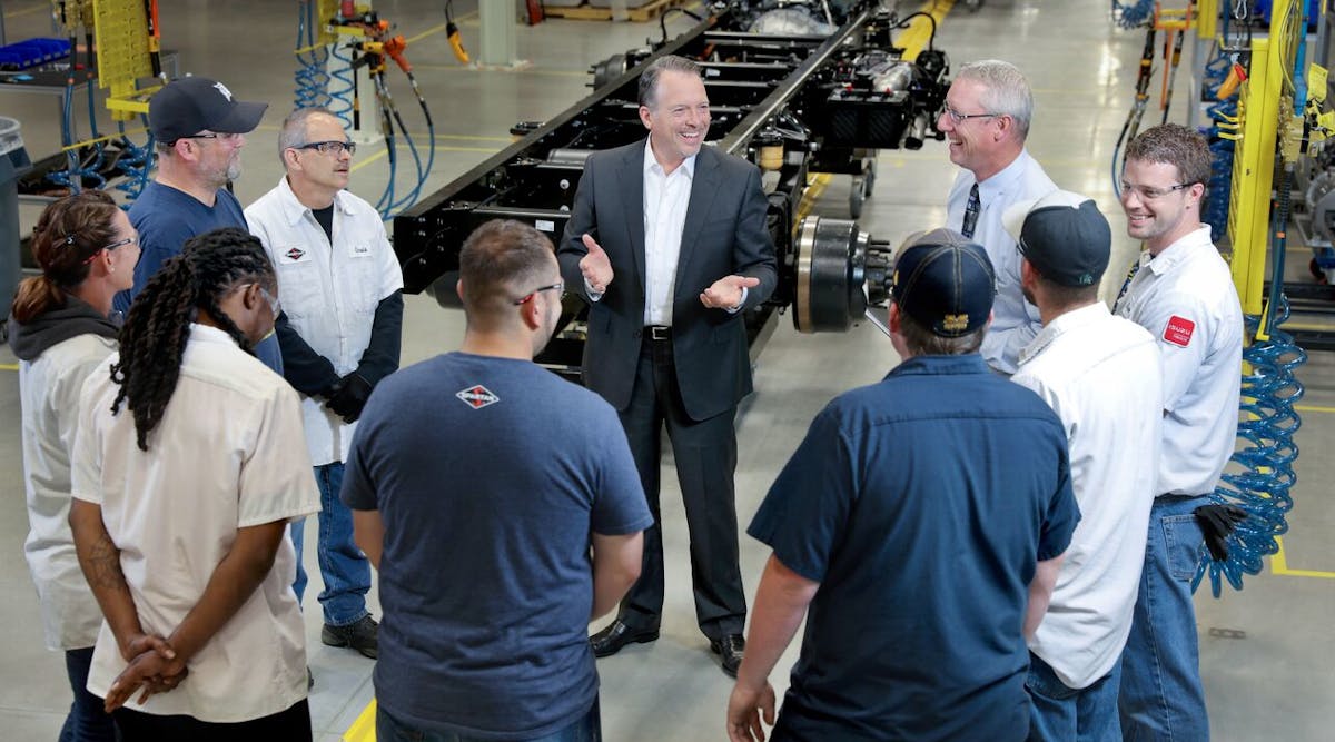 Daryl Adams, president and CEO, Spartan Motors, speaks with Isuzu F-Series production team members at the grand opening of its flexible manufacturing facility in Charlotte, MI.
