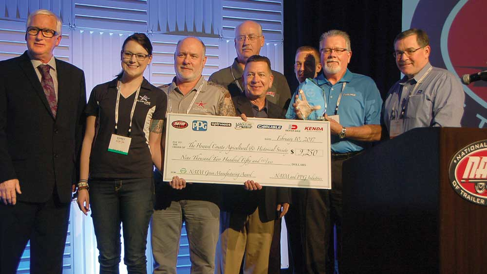 Participating in the Green Manufacturing Award presentation are NATM President Greg Snyder Sydney and Gary Gooder AlumLine Jerry Sampson Kenda Tire Ron Yarnell PPG Marcus Hester Optronics Rick Coffey Carlisle and Adam Dexter Dexter Axle