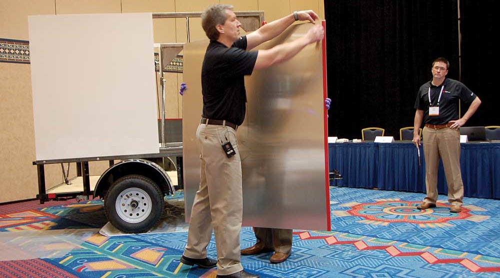 Brent Bystrom demonstrates how quickly a van trailer can be assembled.