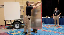 Brent Bystrom demonstrates how quickly a van trailer can be assembled
