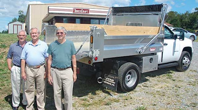 Roy O&rsquo;Neal, sales manager; Gary Shoup, president; and Jerry Pool, operations manager display a sample of an aluminum dump body built at the TruckCraft plant in Chambersburg PA.