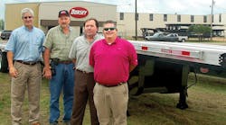 Jeff Pitts, CEO of Pitts Enterprises; Wade Ellis, plant manager; Bobby Horton, chief engineer; and Trey Gary, president of Dorsey Trailer, are shown with the new Dorsey combo trailer.
