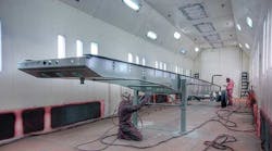 After the steel has been blasted, bathed in iron phosphate, and sealed with Dubois link technology Spectralink non-chrome sealant, surface areas are covered with LV260 epoxy primer at a thickness of approximately four to five wet mils.