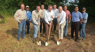 Breaking ground for the new Travis Body &amp; Trailer plant expansion are Jason Backs, vice-president of production; C K (Bud) Hughes, president and CEO; and Doug Gwin, CFO. Also shown are Johnny Wilkerson, Ricardo Pruneda, Chris Wisnieski, Troy Fischer, Gerald Mullican, Xavier Torres, and Billy Martinez.