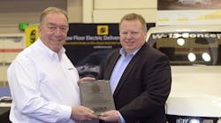 Mike Dektas of Workhorse receives the Most Innovative Vehicle Award from Steve Carey of the NTEA.