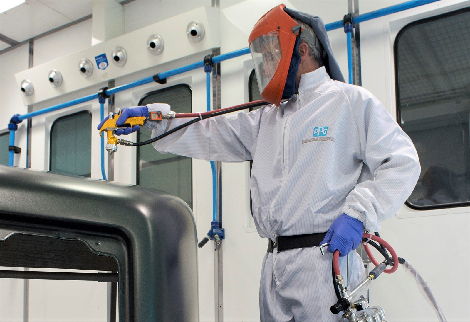 A PPG technician demonstrates its commercial coating application.