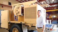 MGS president Andy Gehman with a Trailer-Mounted Shelter Support (TMSS). The system includes shelter, generator, ECU, air compressor, and multiple tools for set-up and tear down. It is usually used by the Marine Corps.