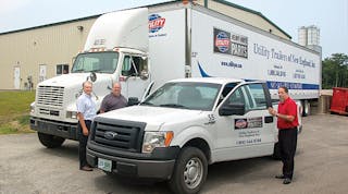 Parts delivery is an important part of the Utility Trailers of New England operation. Shown with some of the delivery vehicles based at the company&rsquo;s North Oxford MA location are Gary Fruscello, vice-president and general manager; Jim Haley, parts director and branch manager, and Norman Vincent, service director.