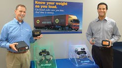 Air-Weigh, Eugene OR, is celebrating its 25th anniversary this year. Steve Womack, dealer sales manager, and Martin Ambros, president and CEO of Air-Weigh, display samples of products that the company has introduced recently.