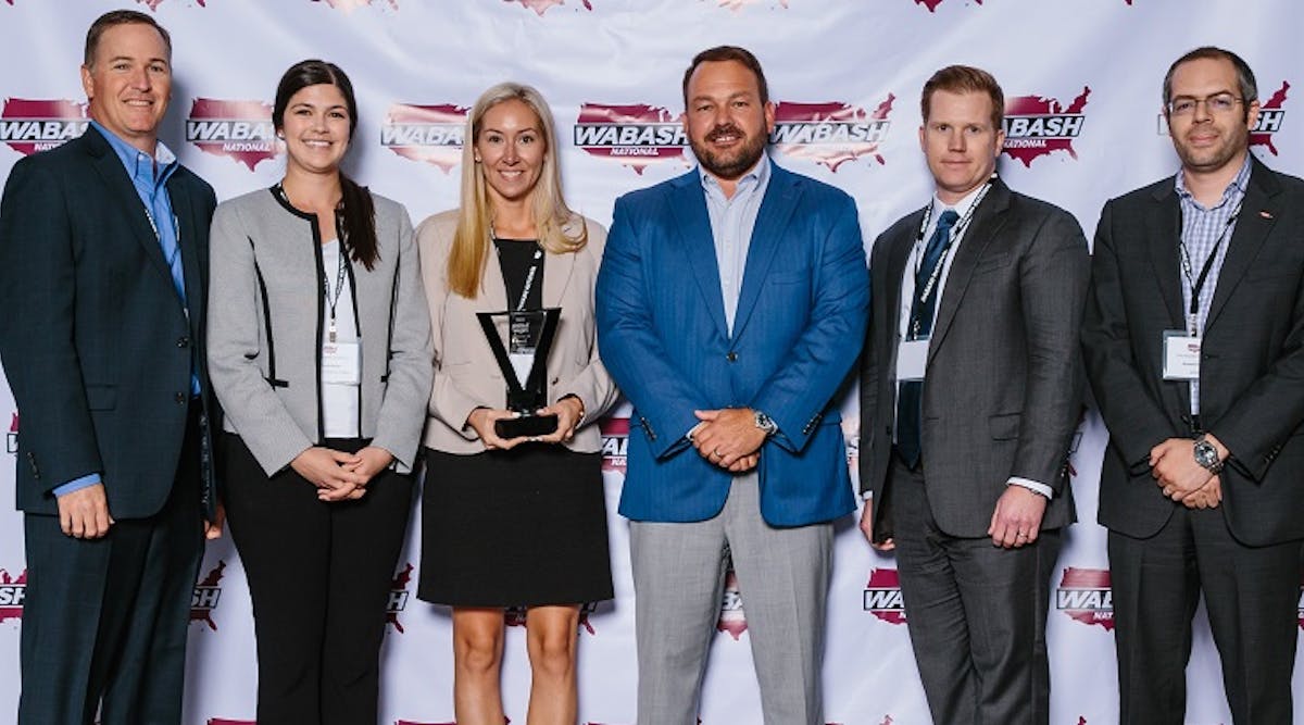 Plastic resin and foam supplier Dow Chemical was named Wabash National&rsquo;s 2018 Pinnacle Award recipient at Wabash&rsquo;s annual Supplier Conference. Pictured from left to right are sales manager Dan Pezolt, technical account manager Chelsea Berger, account manager Lauren Besonen, Wabash President and CEO Brent Yeagy, sales director Brian Sizemore and marketing manager Ahmed Osama.