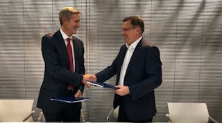 Cummins CEO Tom Linebarger, left, and KAMAZ CO Sergey Kogogin recently signed a Memorandum of Understanding agreeing that Cummins will provide electric power systems for a new line of KAMAZ trucks.
