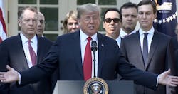 President Donald Trump praises a new trade deal with Canada and Mexico on Monday in Washington DC.