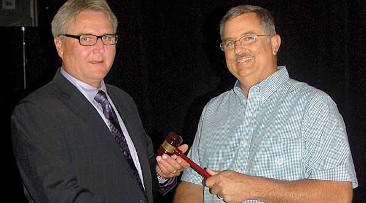 Michael Shuemake, president of Central Valley Trailer Repair, left, receives the gavel of office from Mike Dye, president of Southwest Trailers &amp; Equipment in Oklahoma City.