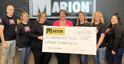 ACS&apos;s Heather Van Vonderen, center, accepts Marion Body Works&apos; donation from, left to right, Marion&apos;s Thomas La Via, Molly Groh, Nancy Ignacio (owner), Gwen Williams, Lynn Kroening and Kylee Berg.