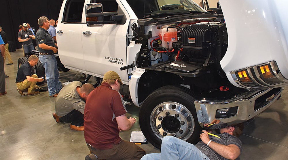 A Chevy Silverado 6500 HD gets a thorough examination from attendees at this year&rsquo;s NTEA Truck Product Conference.