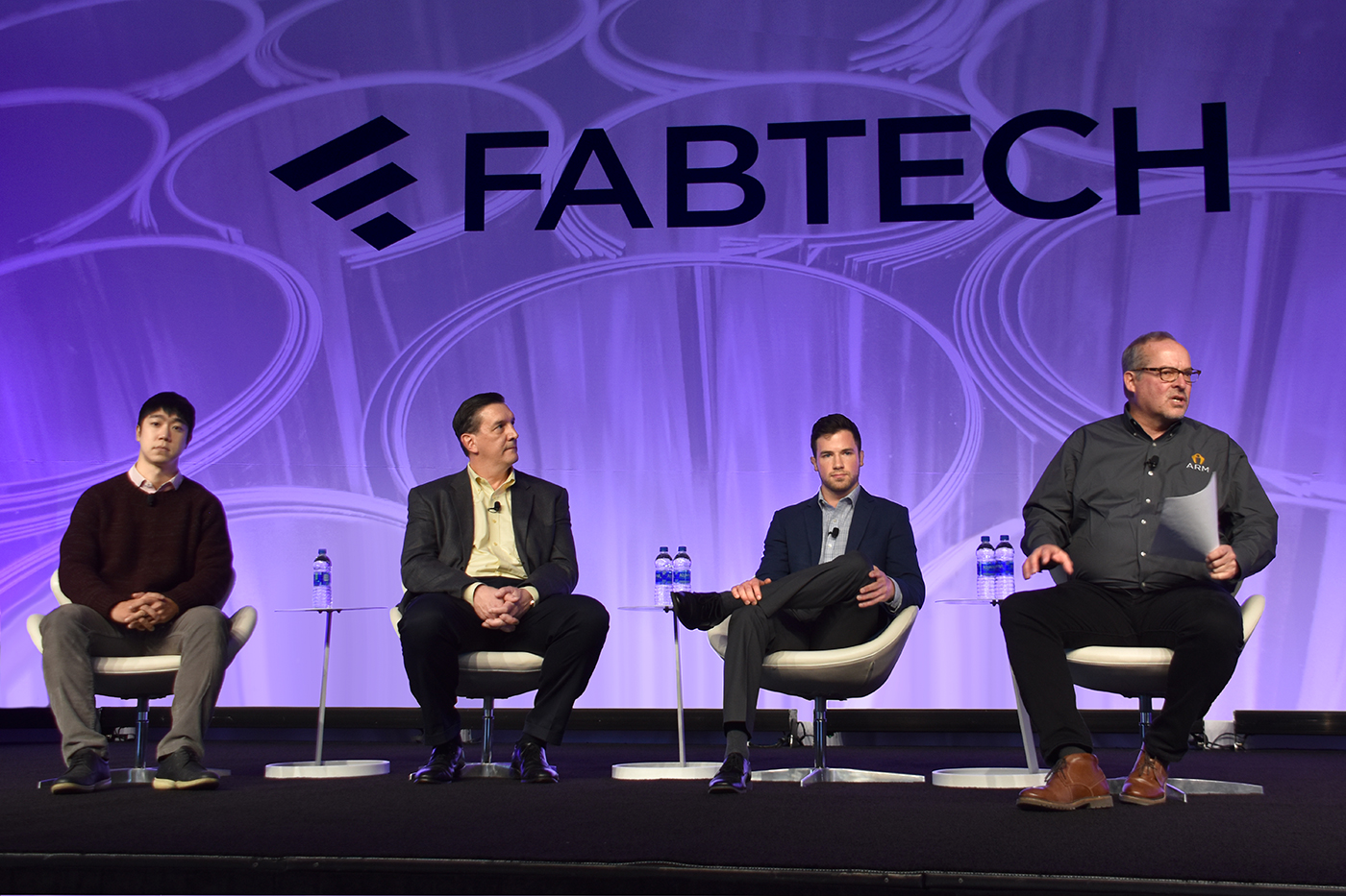 The FABTECH State of the Industry panel discussion on automation included, from the right, moderator Jay Douglass, COO of ARM; Tyler Vizek, Project Engineer for MxD; Steve Czajkowski, head applications engineer, Siemens Industry Inc; and Mingu Kang, CEO of Aris Technology.