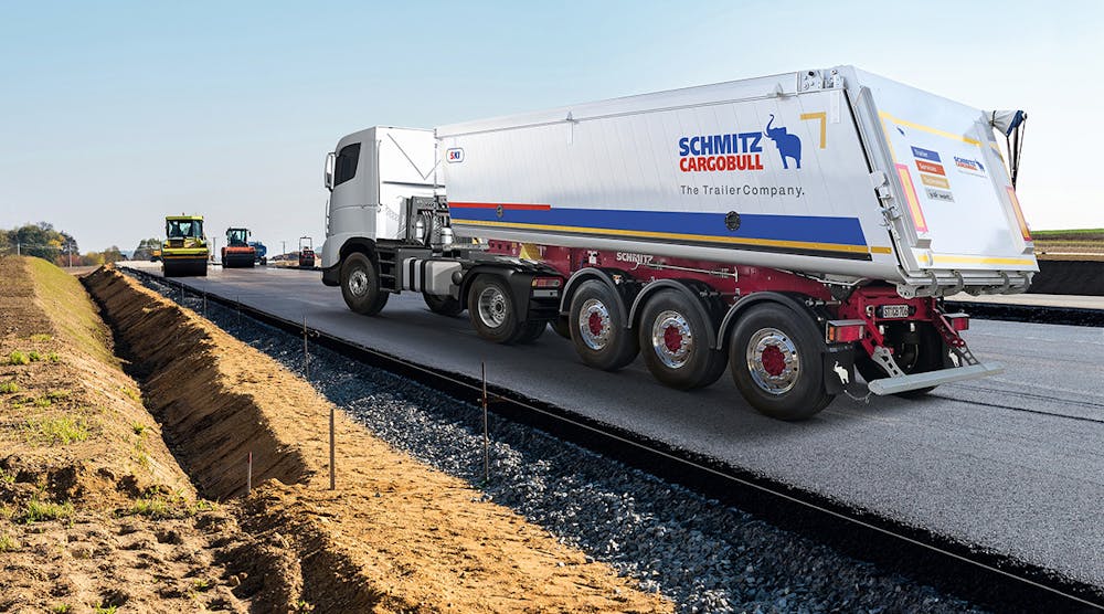 Road construction drives equipment sales worldwide. Above, A Schmitz Cargobull M.KI truck tipper with an electric sliding tarpaulin that can be opened or closed by remote.