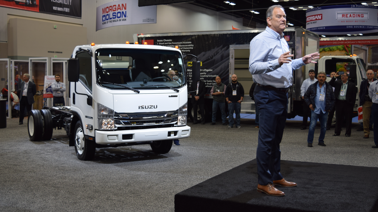 Shaun Skinner, president of Isuzu Commercial Truck of America, and Isuzu Commercial Truck of Canada stands in front of the Isuzu NPR-HD truck during a press conference at the Work Truck Show 2020.