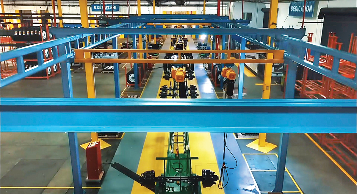 The new production line at CIE Manufacturing in South Gate CA features five stations, with overhead cranes to convey the starting chassis frame on its journey to a completed, fully equipped and inspected intermodal container trailer.