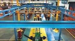 The new production line at CIE Manufacturing in South Gate CA features five stations, with overhead cranes to convey the starting chassis frame on its journey to a completed, fully equipped and inspected intermodal container trailer. The new production line at CIE Manufacturing in South Gate CA features five stations, with overhead cranes to convey the starting chassis frame on its journey to a completed, fully equipped and inspected intermodal container trailer.