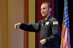 Former fighter pilot Waldo Waldman makes an enthusiastic plea for workplace teamwork during his keynote presentation. Former fighter pilot Waldo Waldman makes an enthusiastic plea for workplace teamwork during his keynote presentation.