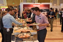 From the 2019 NTDA convention, the exhibit hall buffet draws a crowd of attendees. From the 2019 NTDA convention, the exhibit hall buffet draws a crowd of attendees.