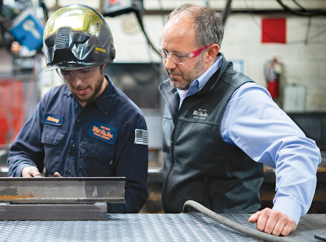 Anthony Bell, team lead, fabrication, (left) and Joshua J. Coster, Wil-Ro Inc. president and owner discuss a welding approach.