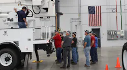 Technicians listen during a demonstration at Terex Utilities' service training.