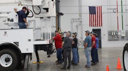 Technicians listen during a demonstration at Terex Utilities&apos; service training.