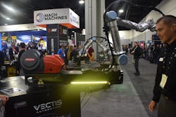 Drew Akey, president and founding partner, Vectis Automation, demonstrates the Park’N’Arc—a rotational range extender that allows for the base of the cobot to be manually moved to various locations. Drew Akey, president and founding partner, Vectis Automation, demonstrates the Park’N’Arc—a rotational range extender that allows for the base of the cobot to be manually moved to various locations.