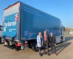 From left, Sabine Essmann of Schmitz Cargobull; Bruno Altenschöpfer, Fleet Manager at hylane; and Dirk Nuxoll, managing director forGRW, deliver the hydrogen-powered vehicle for its first use on the road. From left, Sabine Essmann of Schmitz Cargobull; Bruno Altenschöpfer, Fleet Manager at hylane; and Dirk Nuxoll, managing director forGRW, deliver the hydrogen-powered vehicle for its first use on the road.