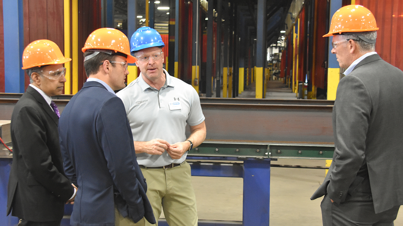 Stoughton Trailers CEO Bob Wahlin explains the chassis production line to committee members, from left, Rep. Raja Krishnamoorthi (D-Ill.), Rep. Rep. Mike Gallagher (R-Wis.), and Rep. Darin LaHood (R-Ill.).