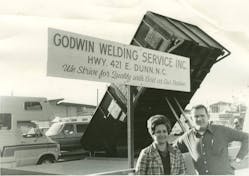 Judy and Pat Godwin stand in front of the welding business that would become the foundation The Godwin Group&rsquo;s portfolio of companies.