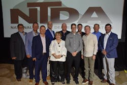 NTDA board members are, from left to right on the front row: Justin Cravens, Ridewell Suspensions; NTDA President Gwen Brown; Charlie Blyth, Blyth Trailer Sales; Bill Nehmer, Great Dane of Utah; David Saunders, Interstate Utility Trailer. Back Row: Bill Schaffer, Overseas Hardwoods Co.; Chad Strader, Ervin Equipment Inc.; 2024 NTDA Chairman Justin Deputy, 1580 Utility Trailer; Gene Masteller, Atlantic Great Dane; NTDA First Vice Chairman Mack Keay, Ocean Trailer; Bobby Briggs, Peak Trailer Group. Not Pictured: Heather Wilson, BMO. NTDA board members are, from left to right on the front row: Justin Cravens, Ridewell Suspensions; NTDA President Gwen Brown; Charlie Blyth, Blyth Trailer Sales; Bill Nehmer, Great Dane of Utah; David Saunders, Interstate Utility Trailer. Back Row: Bill Schaffer, Overseas Hardwoods Co.; Chad Strader, Ervin Equipment Inc.; 2024 NTDA Chairman Justin Deputy, 1580 Utility Trailer; Gene Masteller, Atlantic Great Dane; NTDA First Vice Chairman Mack Keay, Ocean Trailer; Bobby Briggs, Peak Trailer Group. Not Pictured: Heather Wilson, BMO.