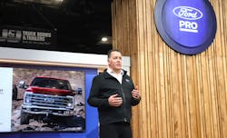 Tim Baughman, Ford Pro general manager, discusses Ford wins and E-Transit updates before giving way to a customer panel on Ford Pro telematics benefits Tuesday night during a live-streamed event at NTEA&apos;s Work Truck Week in Indianapolis, Indiana.