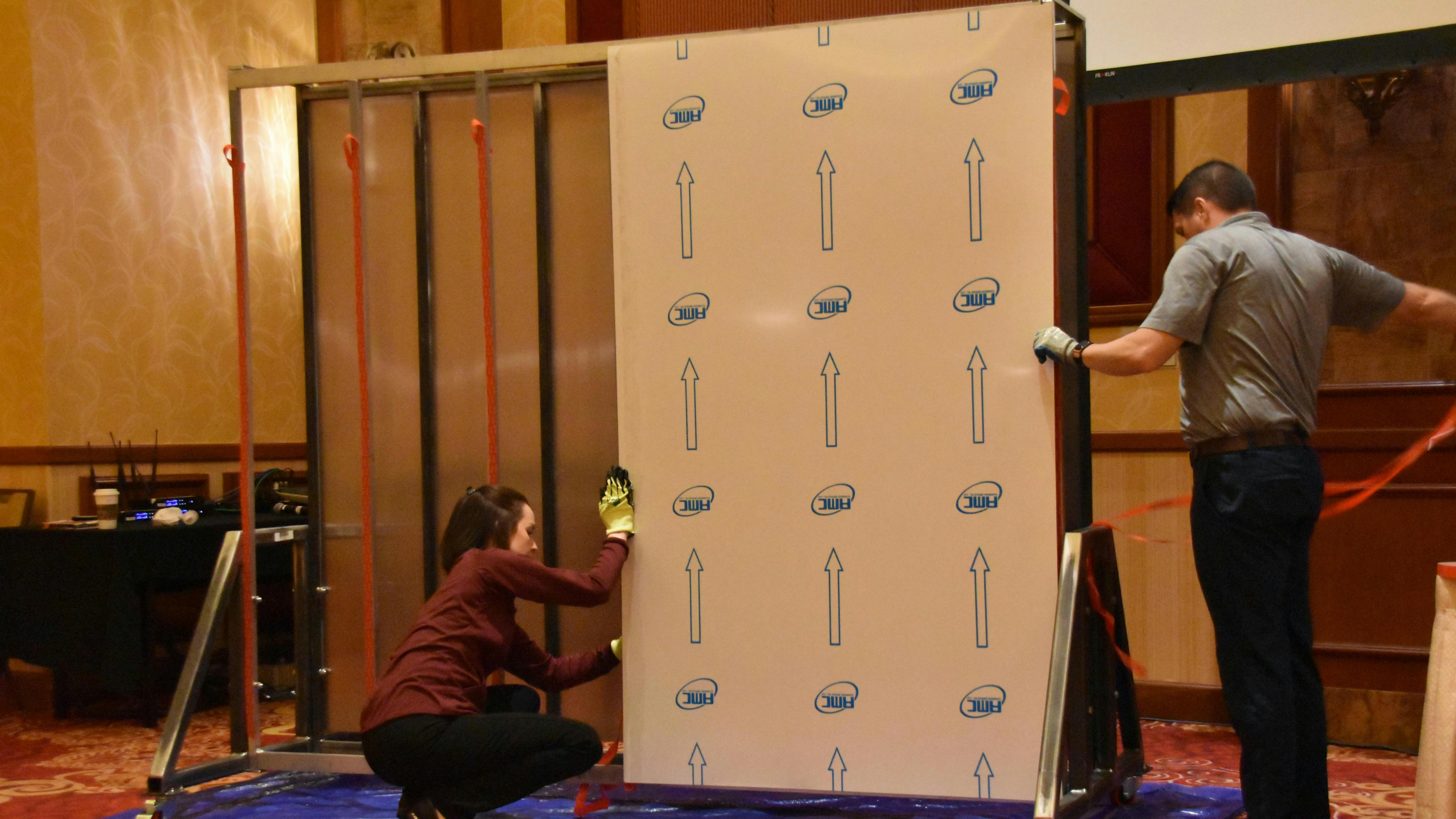 The 3M team demonstrated the proper technique for applying acrylic foam tape by assembling a side wall during the NATM presentation.
