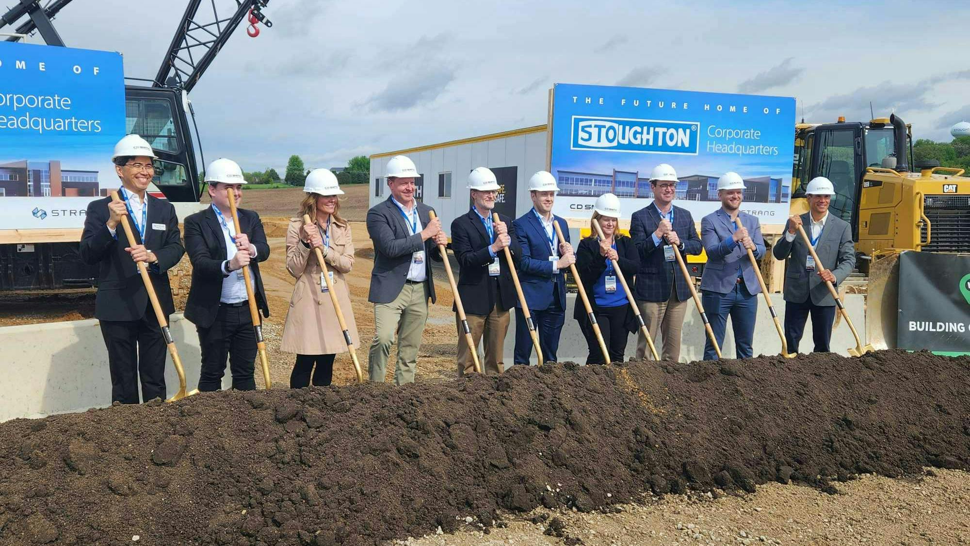 Ceremonial group photo featuring Bob Wahlin, Ken Wahlin, Sue Vanderbilt, John Booher, and Daniele Thompson of Stoughton Trailers, Austen Conrad and Peter Tan of architecture firm Strang, and Steve Braatz and Dane Bernau of construction company CD Smith.