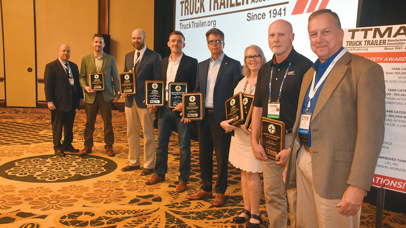 TTMA Chairs Sean Kenney, left, and Jeff Thompson, right, flank Plant Safety Award winners ZF Group (Ben Brown), Trail King Industries (Nick Nielson), Wabash (Dustin Smith), Great Dane (Rick Mullininx), En Trans International (Karen Czor), and LBT Inc. (Scott Hevelone).
