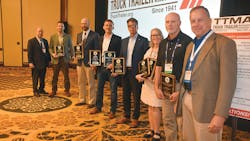 TTMA Chairs Sean Kenney, left, and Jeff Thompson, right, flank Plant Safety Award winners ZF Group (Ben Brown), Trail King Industries (Nick Nielson), Wabash (Dustin Smith), Great Dane (Rick Mullininx), En Trans International (Karen Czor), and LBT Inc. (Scott Hevelone). TTMA Chairs Sean Kenney, left, and Jeff Thompson, right, flank Plant Safety Award winners ZF Group (Ben Brown), Trail King Industries (Nick Nielson), Wabash (Dustin Smith), Great Dane (Rick Mullininx), En Trans International (Karen Czor), and LBT Inc. (Scott Hevelone).