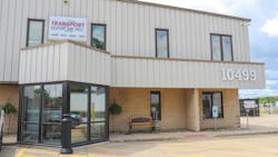 Transport Services, Inc. is flanked by storage and landscaping businesses. Transport Services, Inc. is flanked by storage and landscaping businesses.