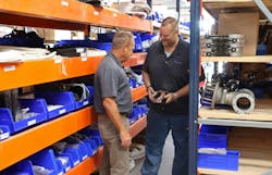 Jeff Creek, at left, and Bryan Metcalf inspect a part. Jeff Creek, at left, and Bryan Metcalf inspect a part.