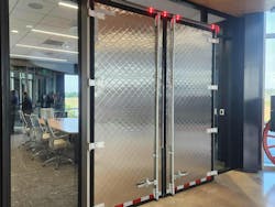 A meeting room connected to the main lobby includes a set of reefer doors. A meeting room connected to the main lobby includes a set of reefer doors.