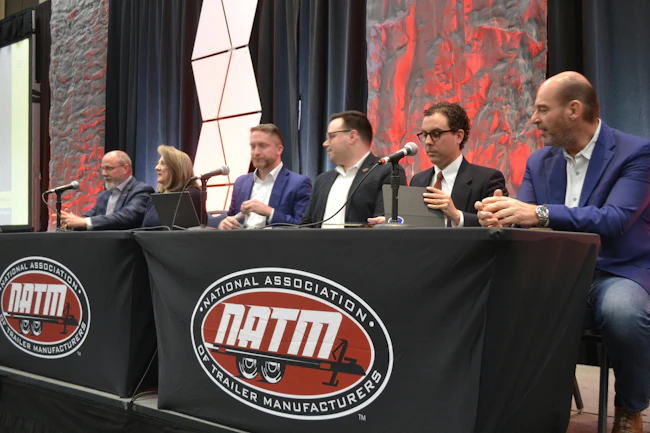 Particpating in the NATM government affairs panel are, from left, Charles and Pam Daughtery, Red Fern Dynamics; Brody Garland, K&L Gates; Alex Stowe, NATM; Brian Hopkins, K&L Gates; and Leo Akins, Forest River.